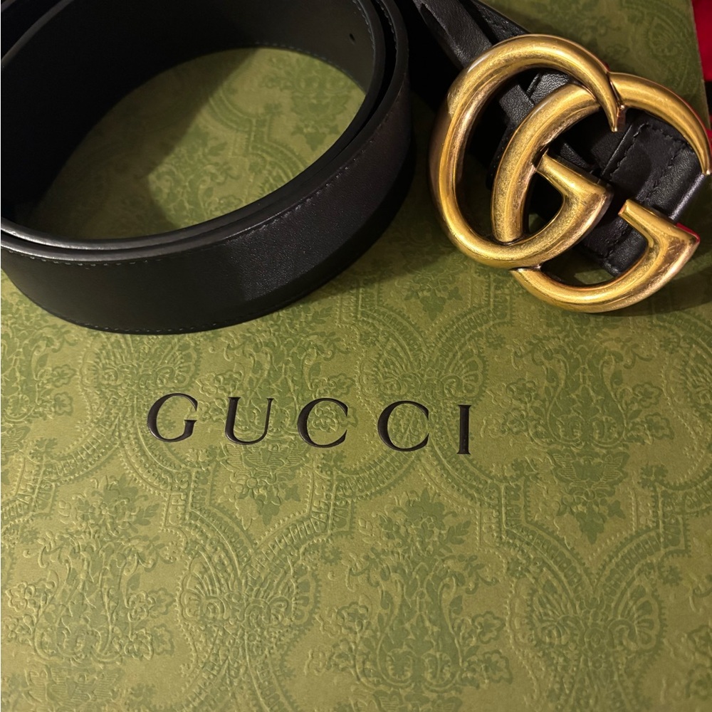 Gucci Black and Gold Leather Belt with Iconic GG Buckle